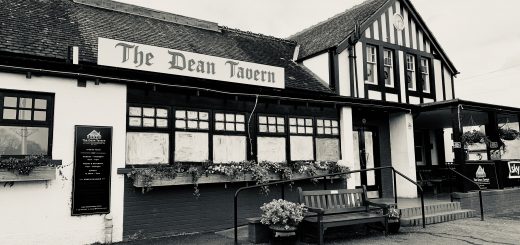 Exterior of the Dean Tavern closed with windows painted over