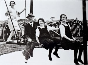 Lord Chelmsford adult and school children on swing at official opening of Newtongrange Welfare Park